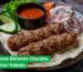 Seekh kebabs served on flatbread with onions, cucumbers, and chutney, highlighting different kebab varieties