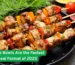 Grilled chicken kebabs with vegetables on skewers served in a pan, fresh herbs and peppers around, with bold food headline