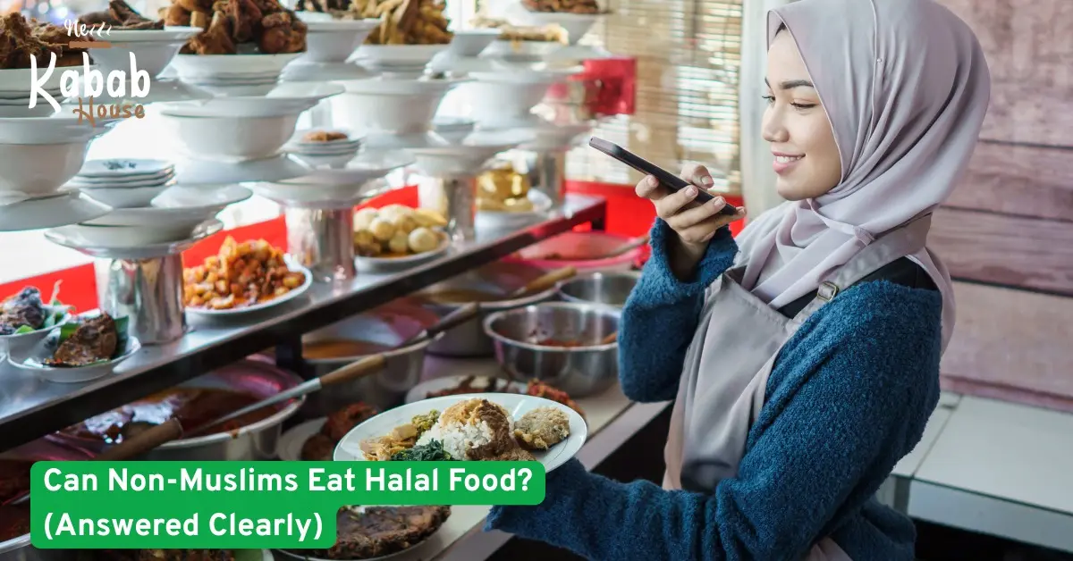 A woman serving halal food at a restaurant counter, explaining whether non-Muslims can eat halal meals prepared with care and hygiene